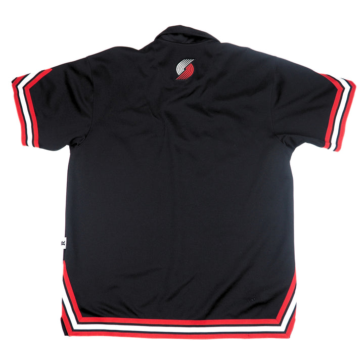 Black shirt with red and white accents on a white background