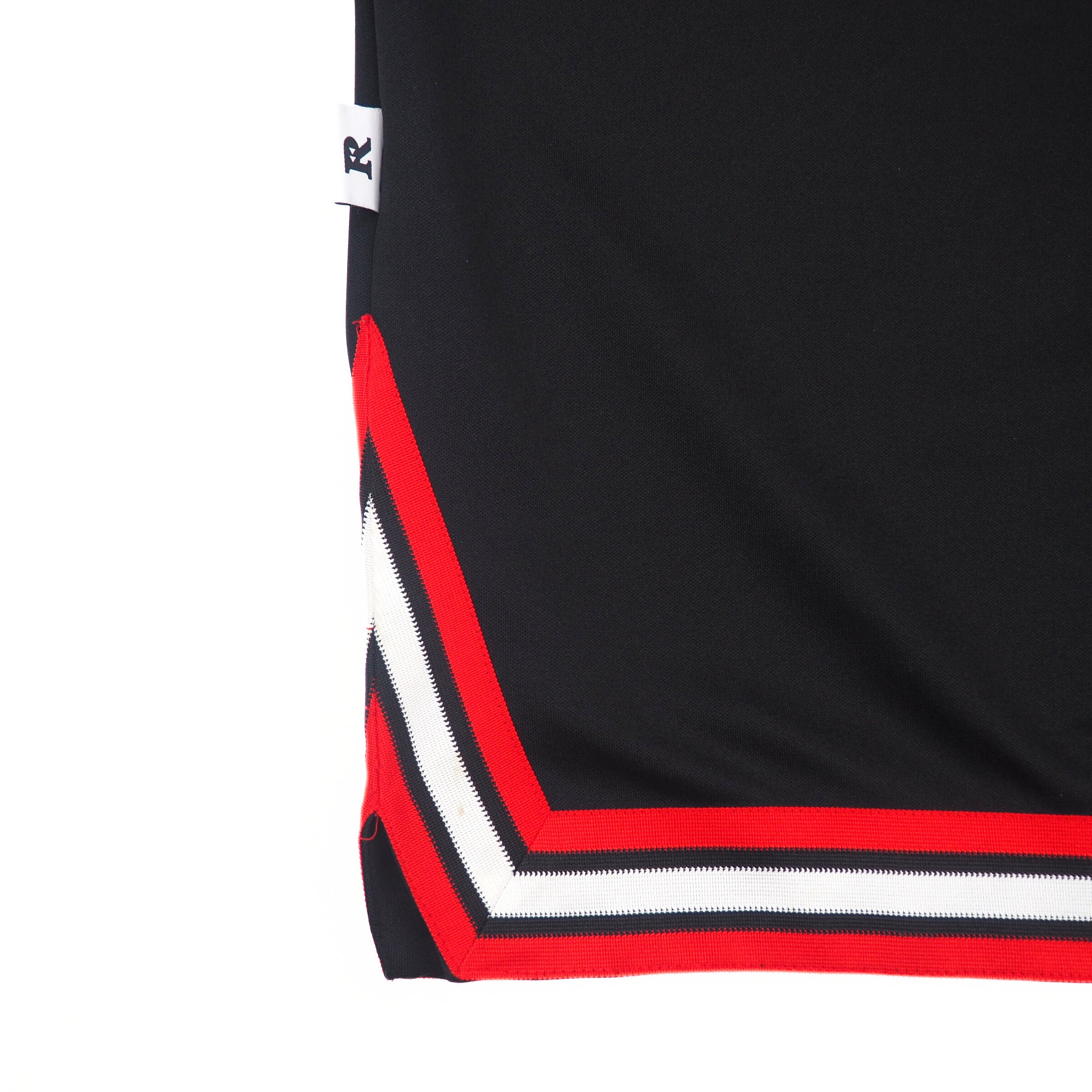Black jacket with red and white trim on a white background