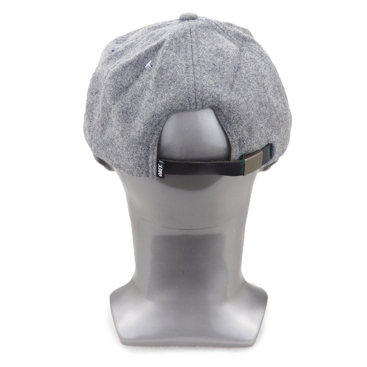Gray cap on a mannequin head against a white background