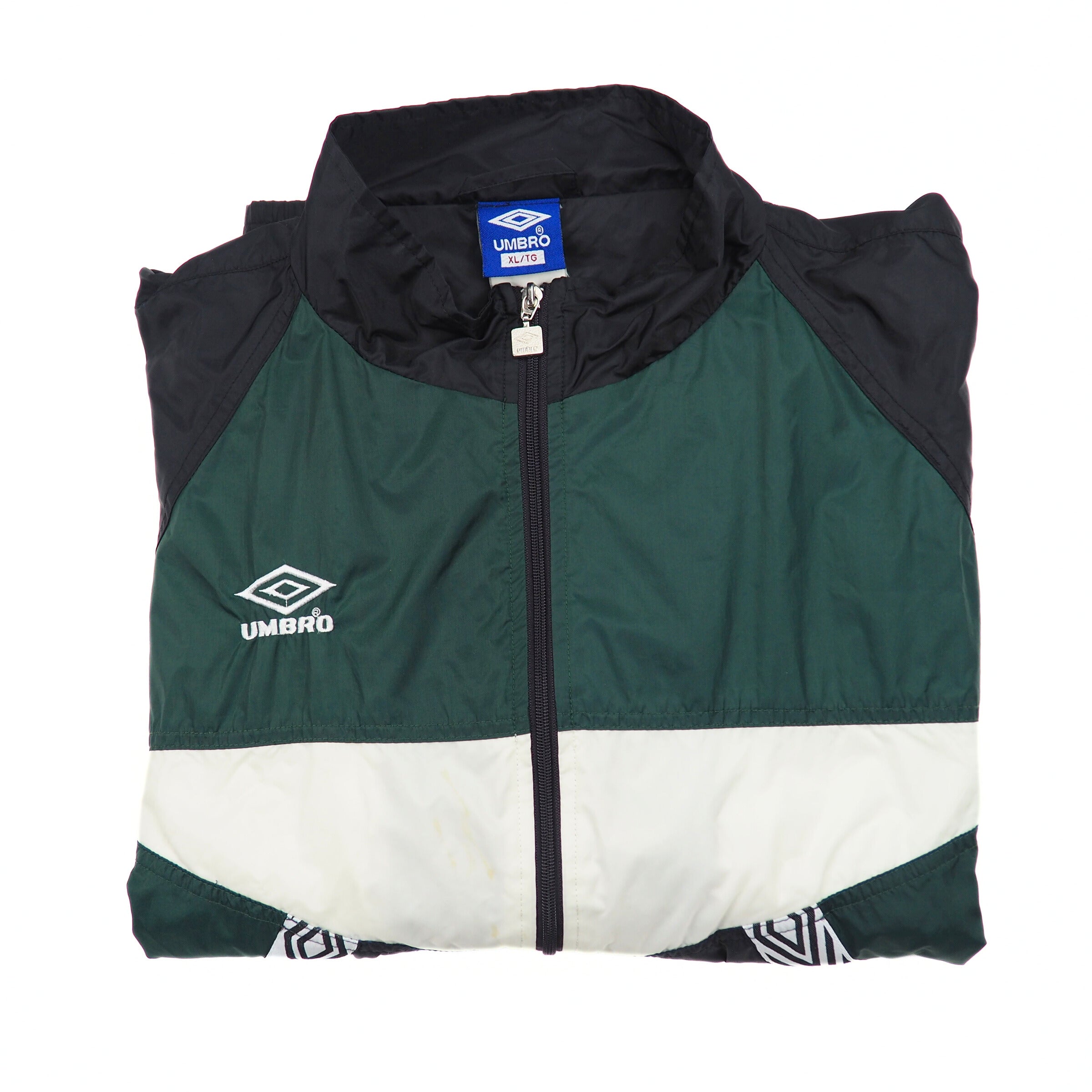 Folded green and black jacket with Umbro logo on a white background